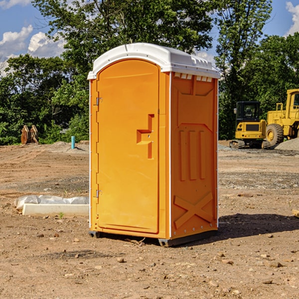 what is the cost difference between standard and deluxe portable restroom rentals in Skidmore